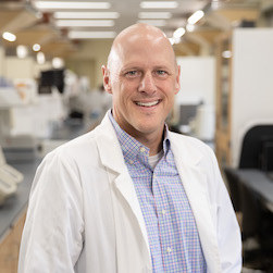 Head shot of Michael Ryan, Ph.D. in the lab