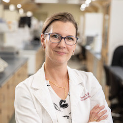 Head shot of Susan Wood, Ph.D. in lab