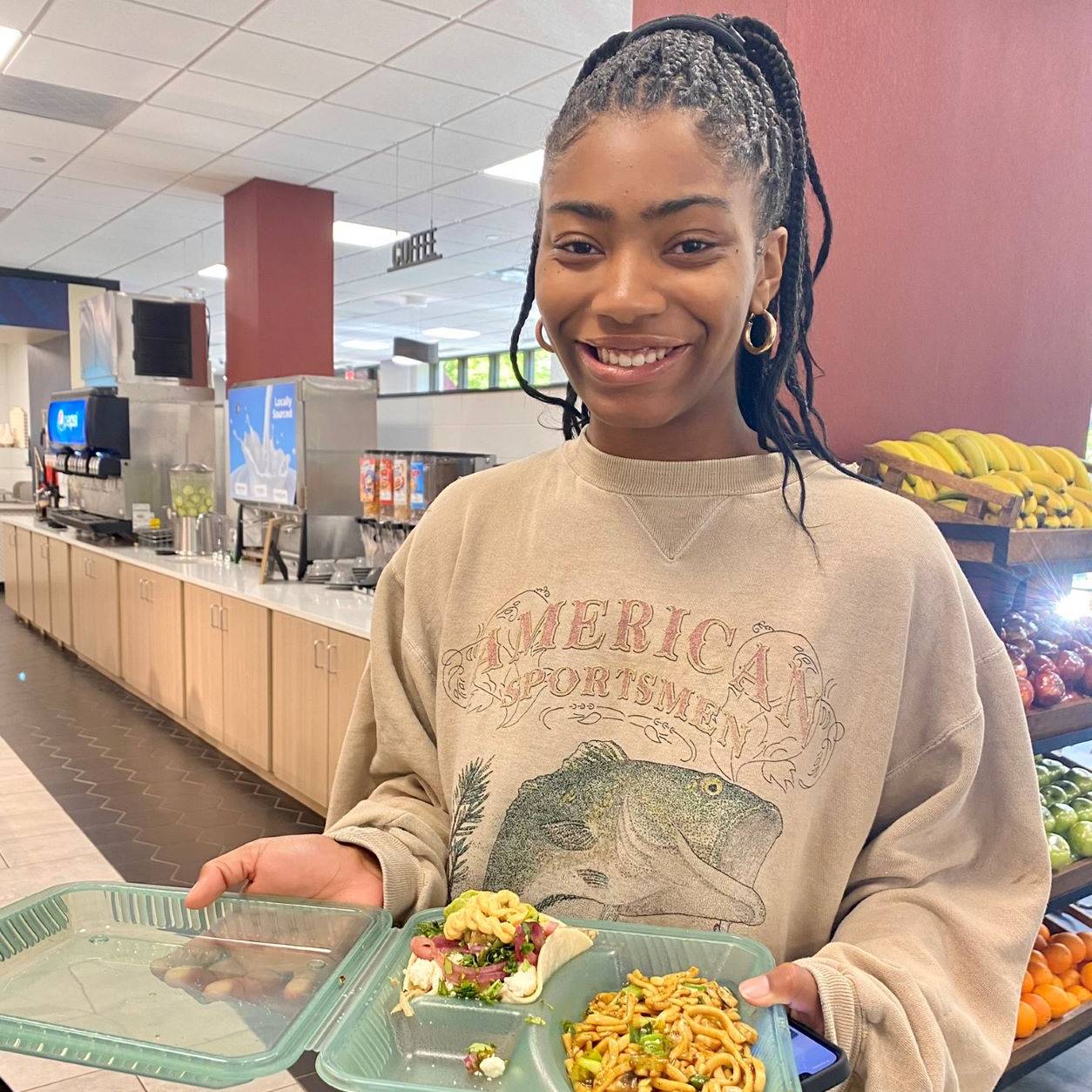 Student with plate in dining hall