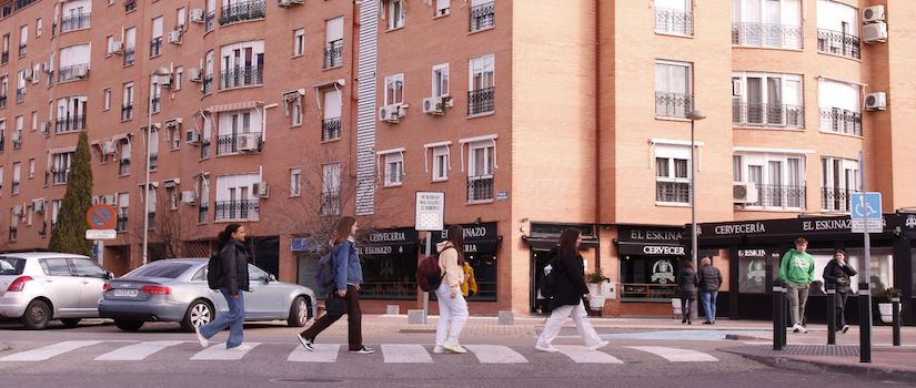 students walking across a crosswalk