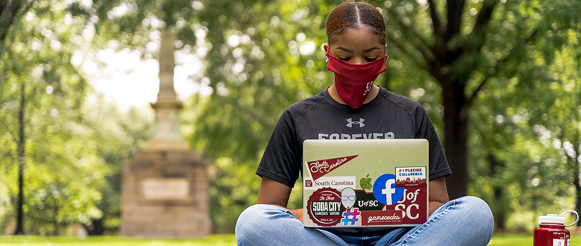 african american student on her laptop in the horsehoe