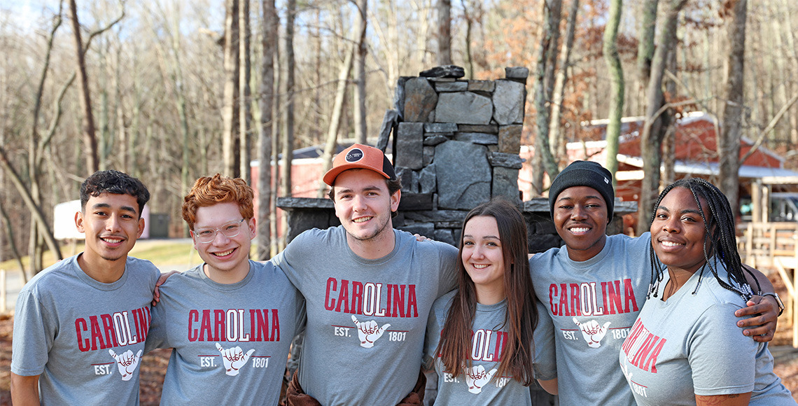 2024 Team Leaders posing for a photo outside