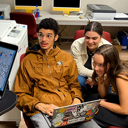 Students looking at design computers