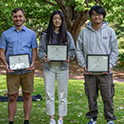 photo of students holding award