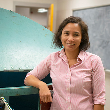 Dr. Sasanakul stands by the centrifuge