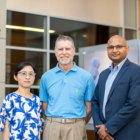 three faculty members