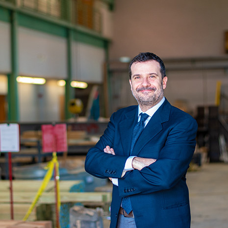 Dr, Matta stands in the civil engineering lab in 300 Main