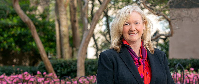 Lori Pennington-Gray headshot outside in lush foliage on the UofSC campus