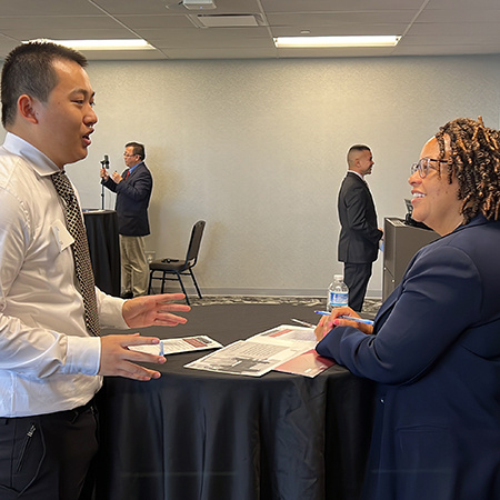 An undergraduate student speaks with an HRSM PhD student during a session of the practical exam.