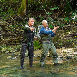 William Dissen fishes in a river