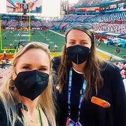 Logan Hudson stands with a friend at Raymond James Stadium for Super Bowl LV.