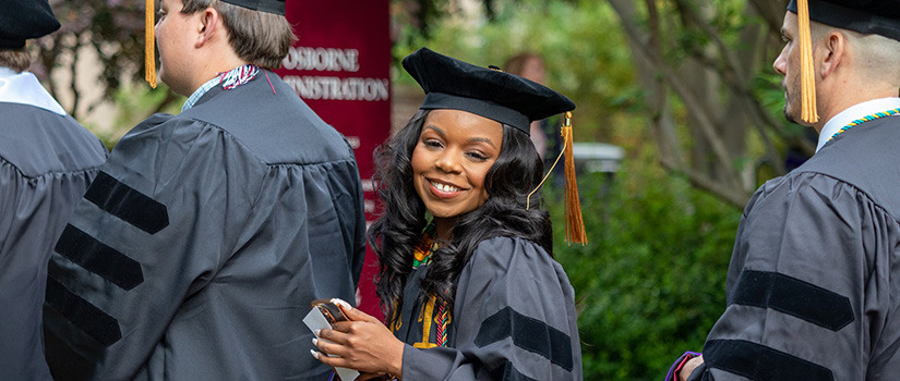 Graduates walking to commencement activities