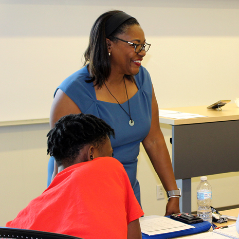 Deborah Hazzard discussing diversity and inclusion with her management class