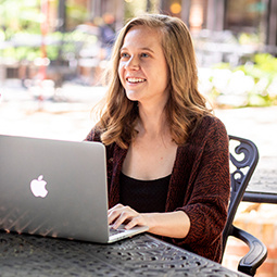 Student at a table with computer