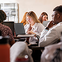 Students studying at a table