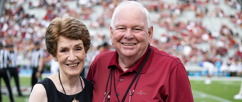 Nancy and Gene Reeder at football game