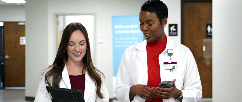 Two pharmacists in an office