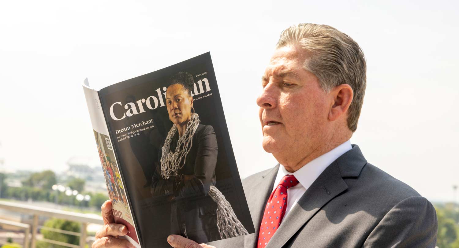 Ray Tanner reading Carolinian magazine.