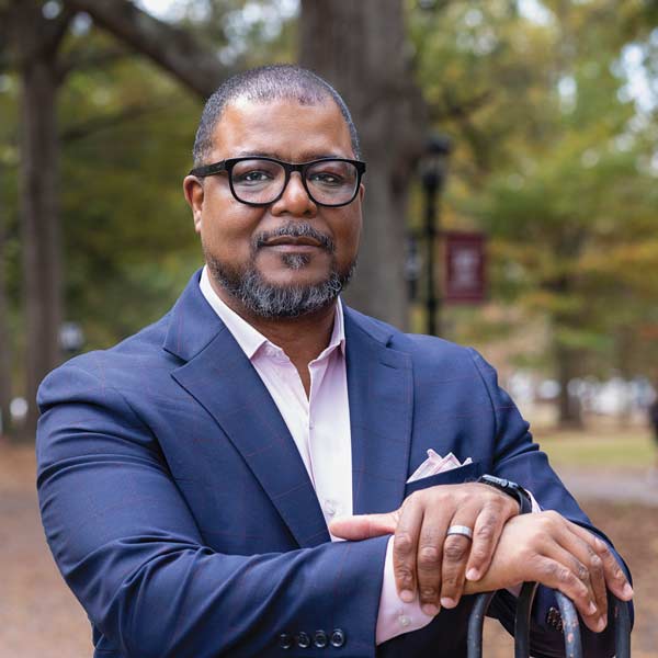 A portrait of Leroy Chapman with the USC Horseshoe in the background.